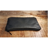 Italian upholstery leather zippered pouch.